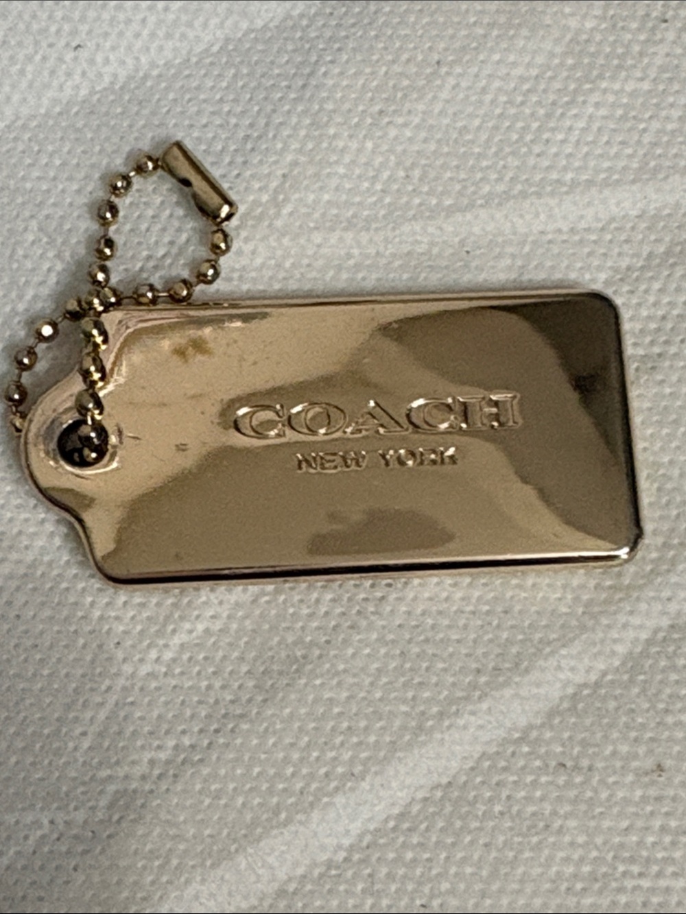 Coach Gold Metal Logo Tag
